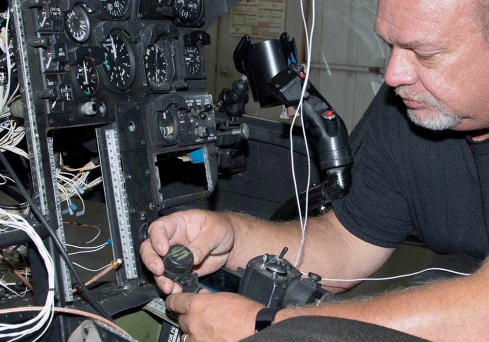 HeliServ technician performing helicopter maintenance & repairs in Texas