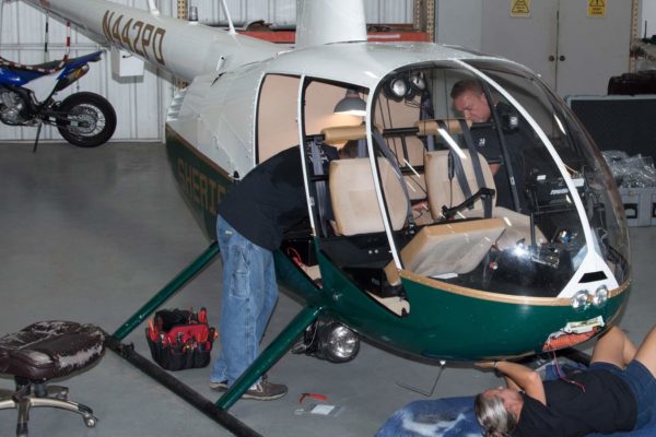HeliServ technicians performing routine helicopter maintenance & repairs in Texas