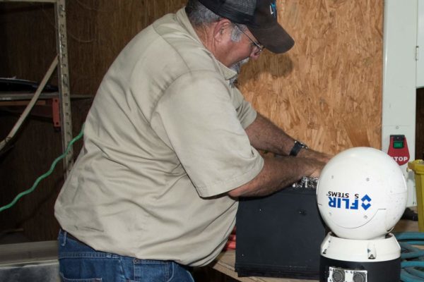 HeliServ technician performing routine helicopter maintenance & repairs in Texas
