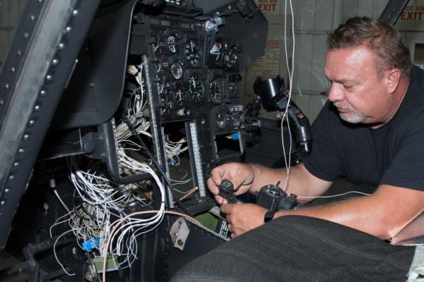 HeliServ technician performing routine helicopter maintenance & repairs in Texas